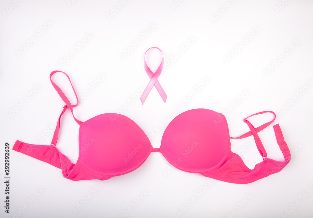 Pink ribbon and pink bra on white background