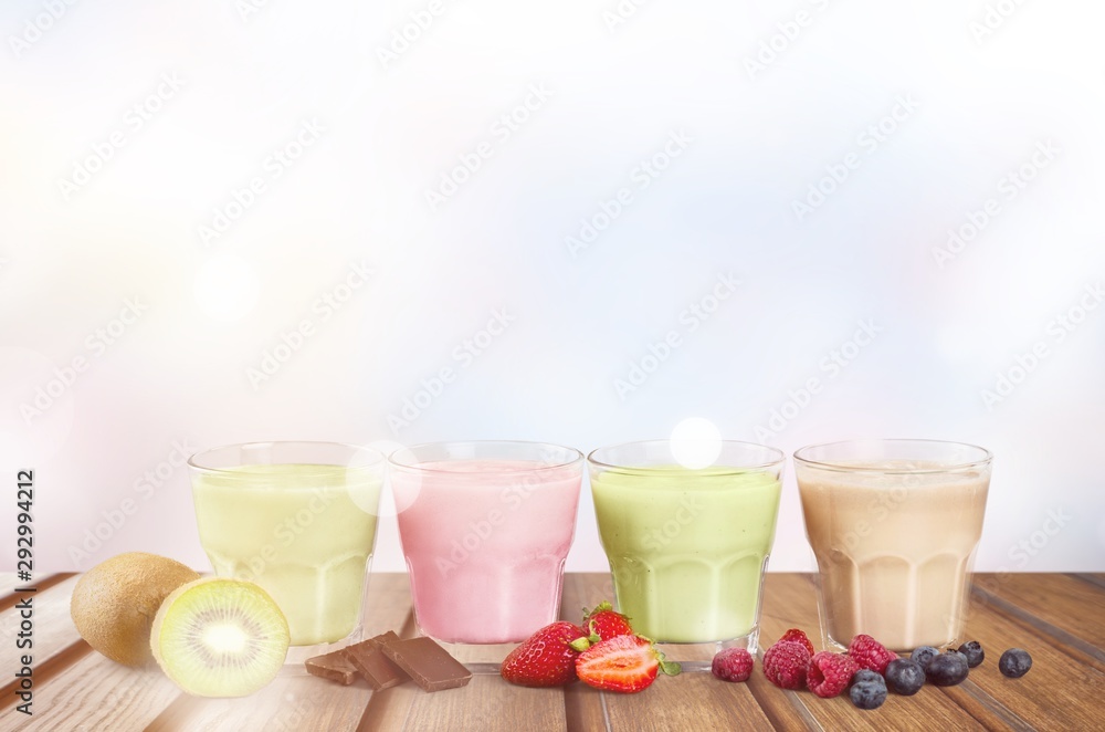 Fruit Smoothies with Straws Isolated on a White Background Fruit Smoothies with Straws Isolated on a White Background
