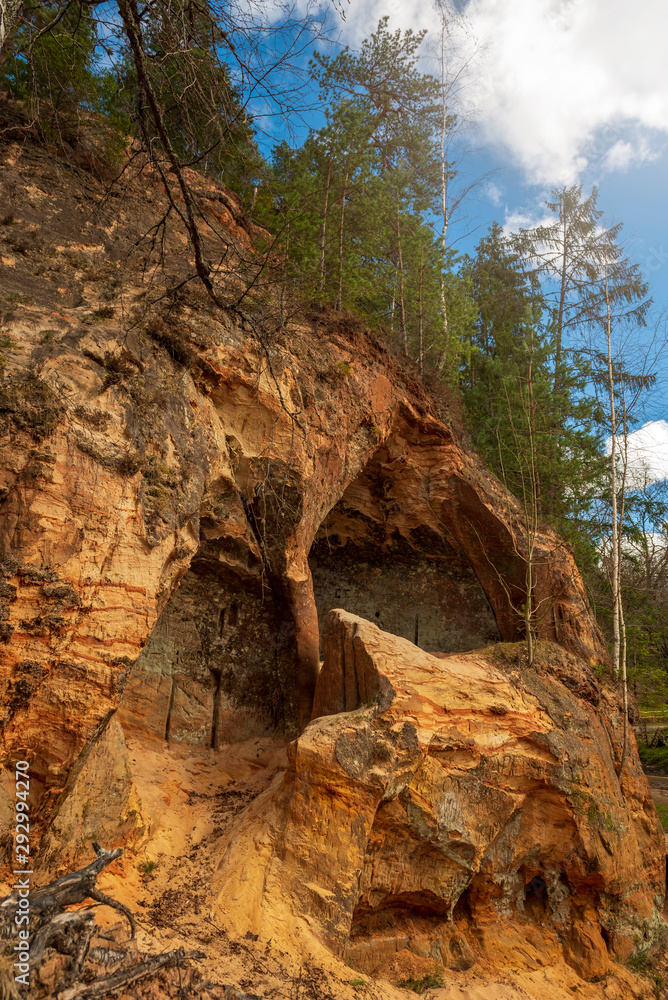 Sandstone Caves in Ligatne, Latvia. Caves with old wooden doors. Sandstone Caves in Ligatne, Latvia. Caves with old wooden doors.