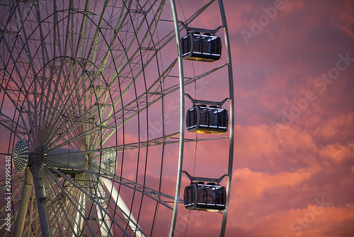 Ferris wheel illuminated with colorful sky in the magic hour