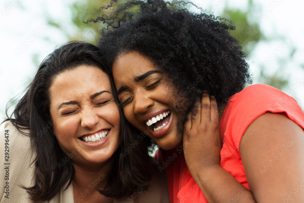 Diverse group of friends talking and laughing. Diverse group of friends talking and laughing.
