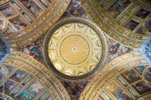 Abstract view of sun streaming onto the frescos of the baroque cupola of the Gesù Nuovo in Naples, Italy