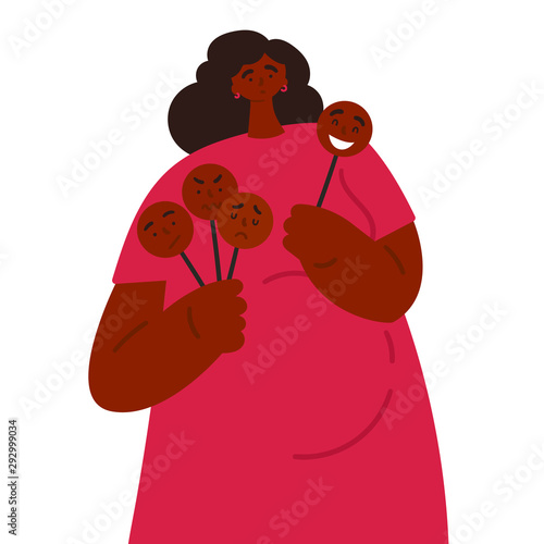 A young pregnant woman in a red dress and holds masks with different emotions.She is tired of the fact that constantly has to play a role, change the mask in public.She got confused in her emotions. 