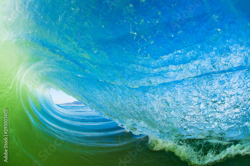 Water shot of a barreling wave breaking on the beach