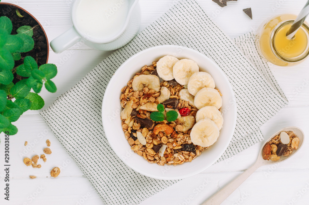 Granola with banana and berries in the bowl Granola with banana and berries in the bowl