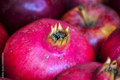 Raw and ripe purple pomegranate fruits close up image, a concept for a Rosh Hashanah Jewish New Year image. 