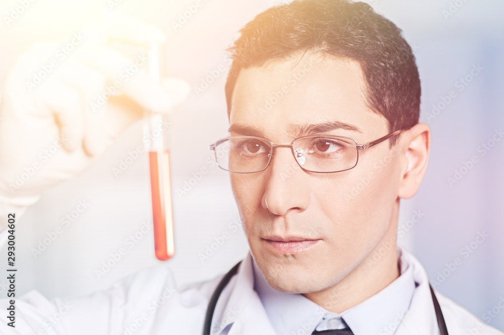 Hand holding syringe and vaccine. Hand holding syringe and vaccine.