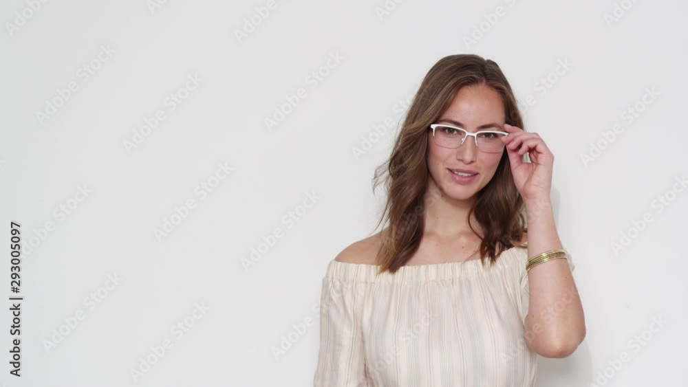 Steady Shot of Pretty Model Fixing Her Glasses and Smiles for the Camera Steady Shot of Pretty Model Fixing Her Glasses and Smiles for the Camera