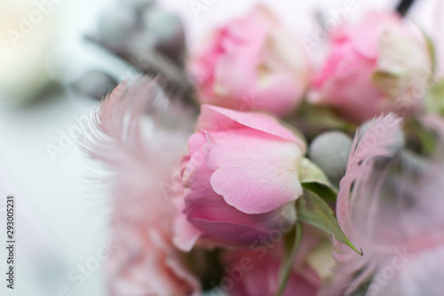 Wedding decorations. Decoration of holidays with fresh flowers. Pink roses and carnations.