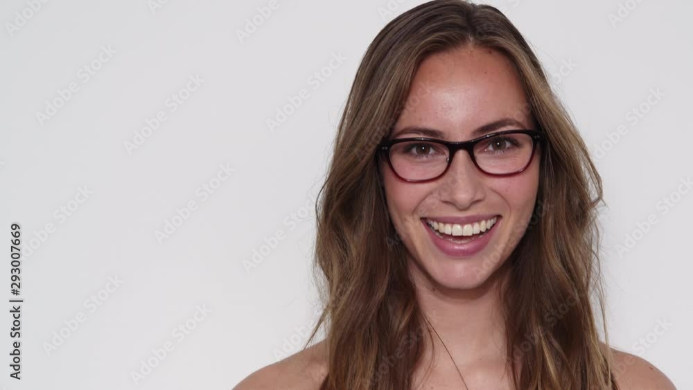 Woman Walking in Frame and then Smiling Attractively while Walking Out of View