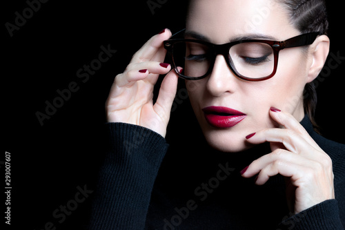 Beautiful woman with braided hair wearing glasses. vision correction, optometry and fashion eyewear concept