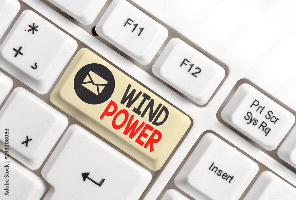 Word writing text Wind Power. Business photo showcasing use of air flowto provide mechanical power to turn generators White pc keyboard with empty note paper above white background key copy space