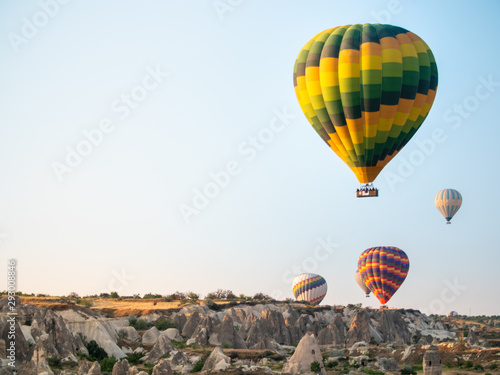 several hot air balloons rising over Cappadocia