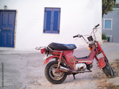 an old red scooter in Greece