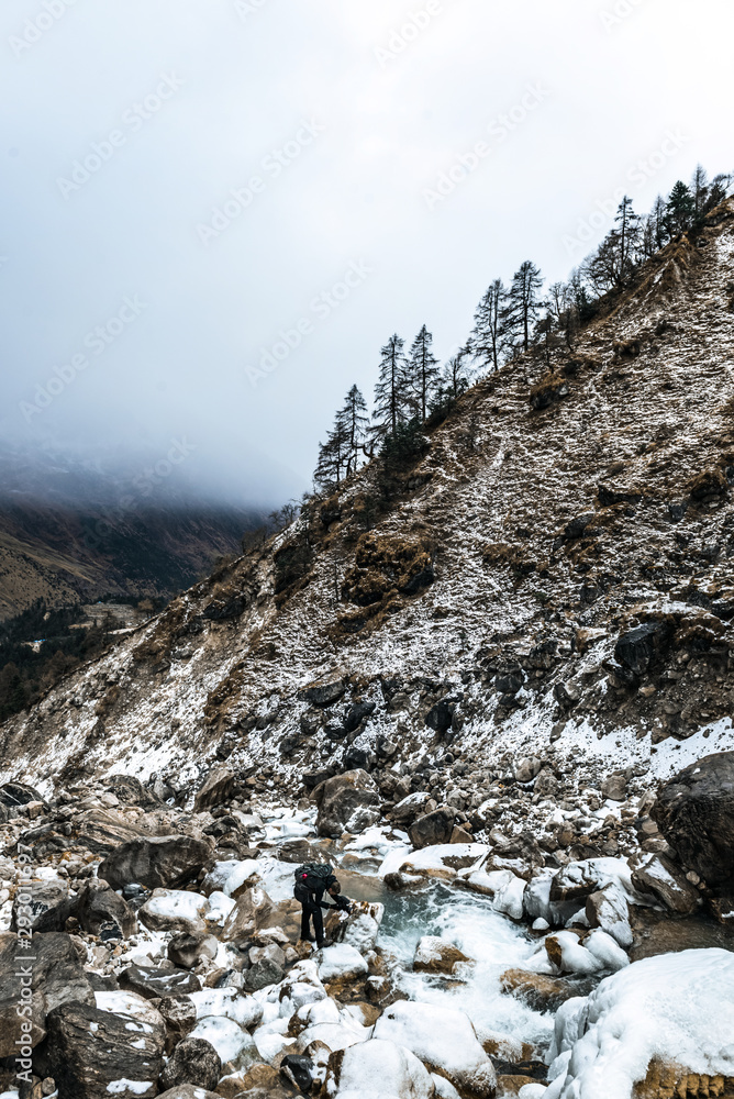 Icy rocks in Himalayan mountain waterfall in Manaslu region, Nepal Icy rocks in Himalayan mountain waterfall in Manaslu region, Nepal
