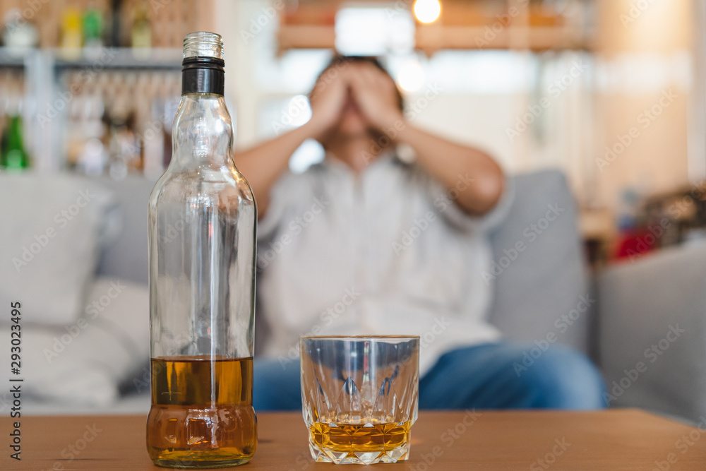 Alcoholism concept. Young man drinking alcohol too much. Alcoholism concept. Young man drinking alcohol too much.