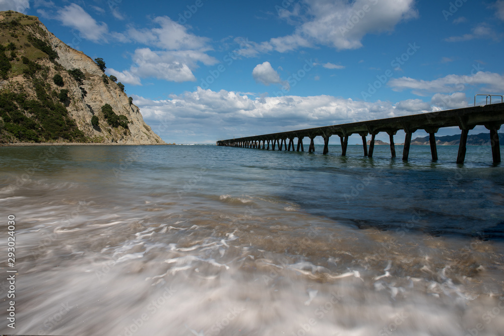 The historic pier at Tokomaru bay vanishing into the distance at New Zealand's east coast The historic pier at Tokomaru bay vanishing into the distance at New Zealand's east coast