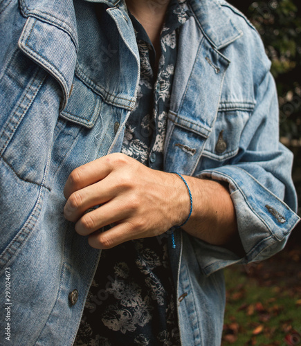 Autumn jean jacket fashion with stylish flowery button-up shirt photo