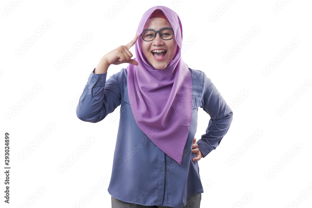 Smart Muslim Woman Pointing on Her Head and Smile Smart Muslim Woman Pointing on Her Head and Smile