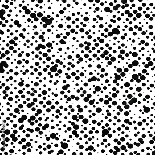 Abstract dalmatian pattern  black dots on white background. Print. Chaotic small black circles  monochrome. 