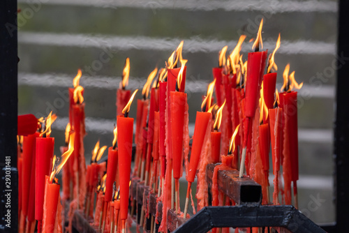 Фотография Red candles burning in a taoist temple in QingChengShan, Sichuan Province, China