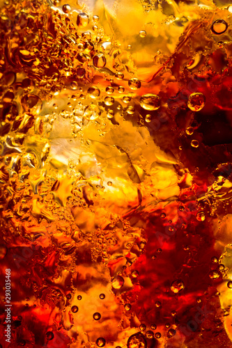 cola drink with ice cubes texture and bubble as a abstract background