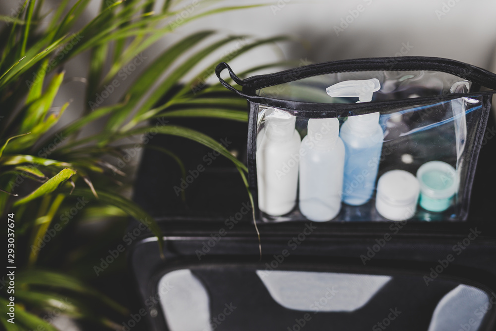 packing for a flight, transparent bag with small lotions for liquids