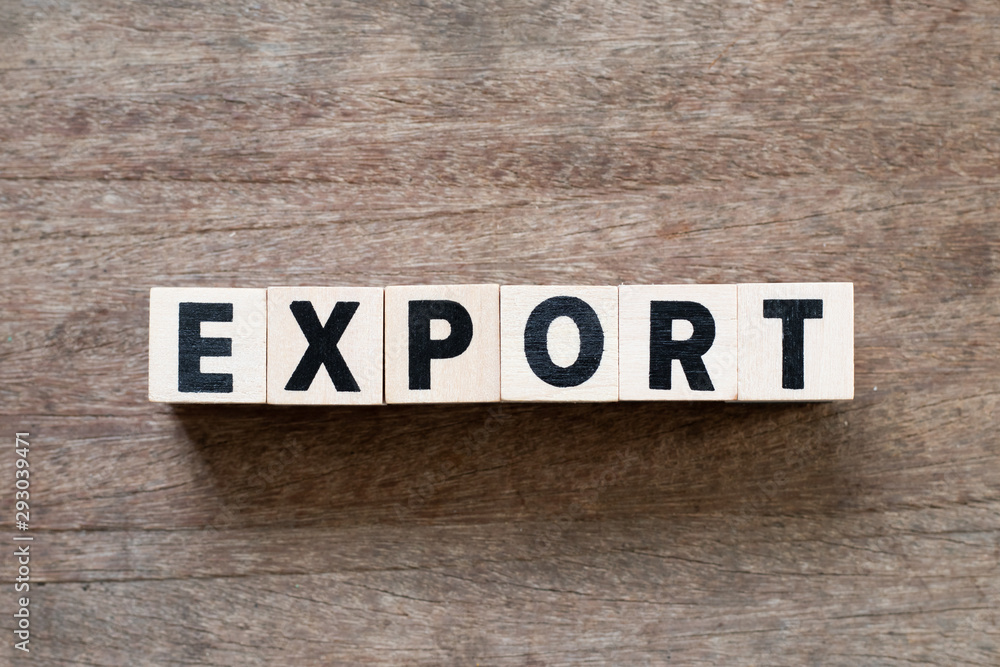 Fototapeta premium Letter block in word export on wood background