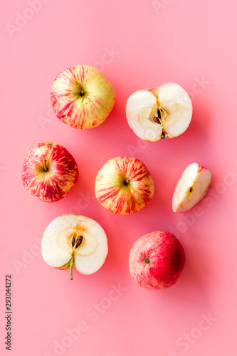 Autumn composition with fresh apples on pink background top view copy space