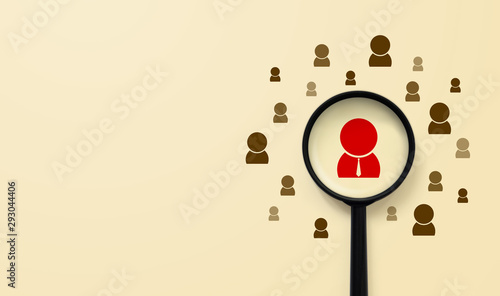Human resources management and recruitment concept. Magnifying glass is searching for the human icon photo