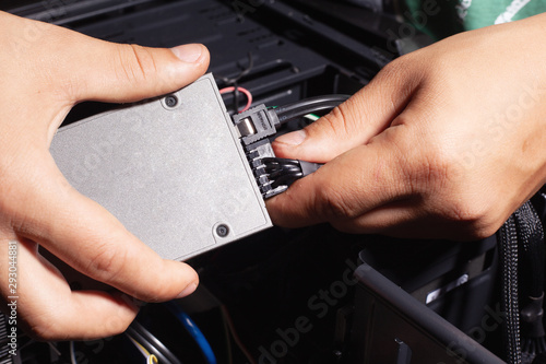 installation and connection of an SSD hard drive by the hands of a computer wizard