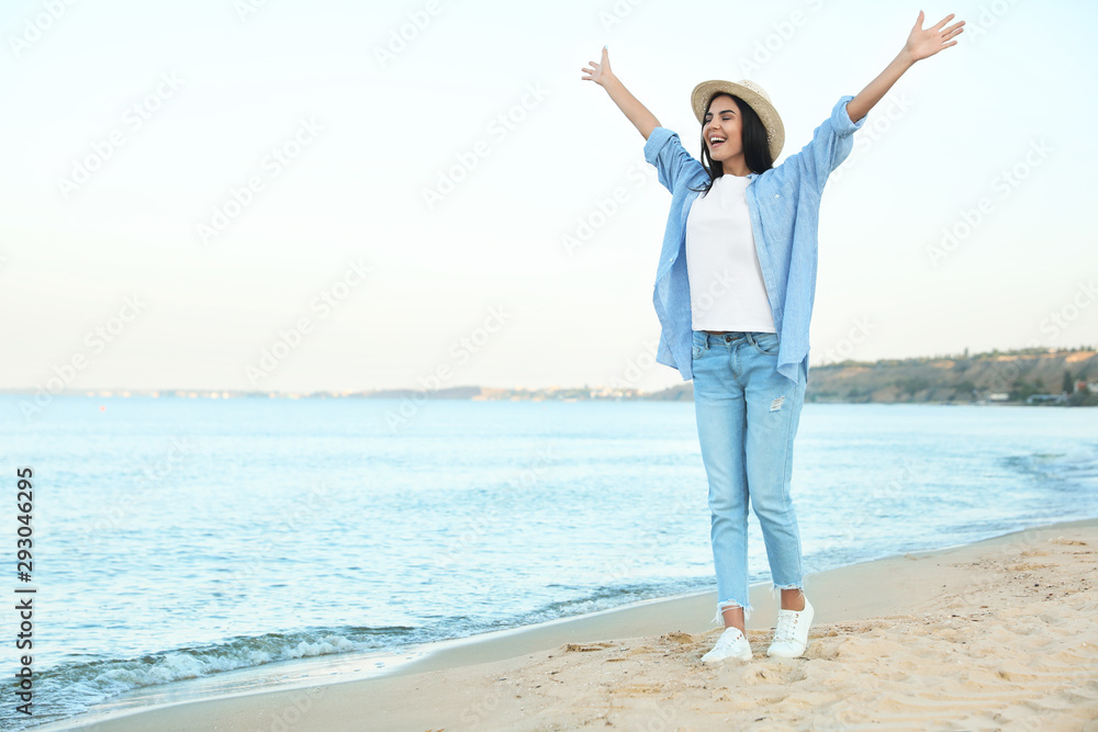 Beautiful young woman in casual outfit on beach Beautiful young woman in casual outfit on beach
