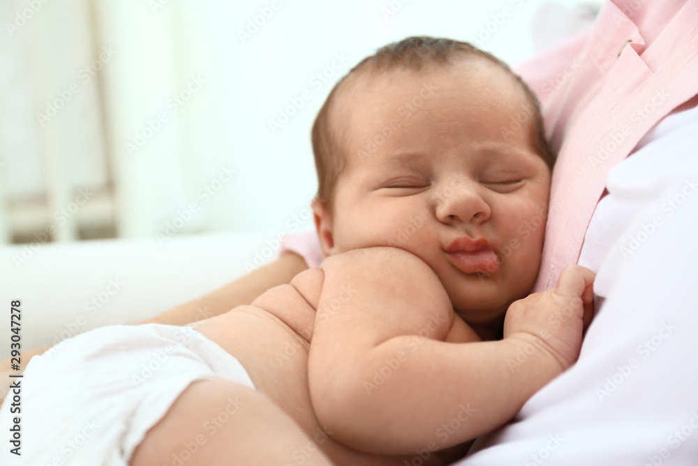 Young mother with her little baby at home Young mother with her little baby at home