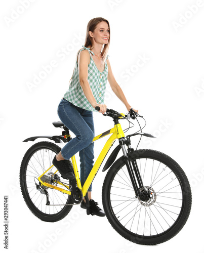 Happy young woman riding bicycle on white background