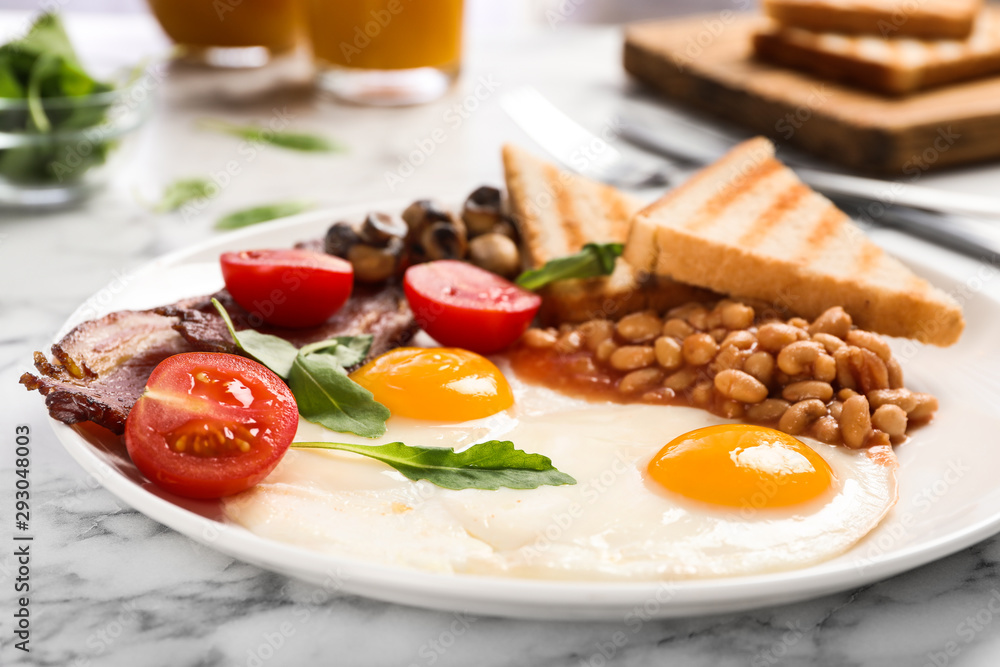 Tasty breakfast with fried eggs on white marble table, closeup Tasty breakfast with fried eggs on white marble table, closeup