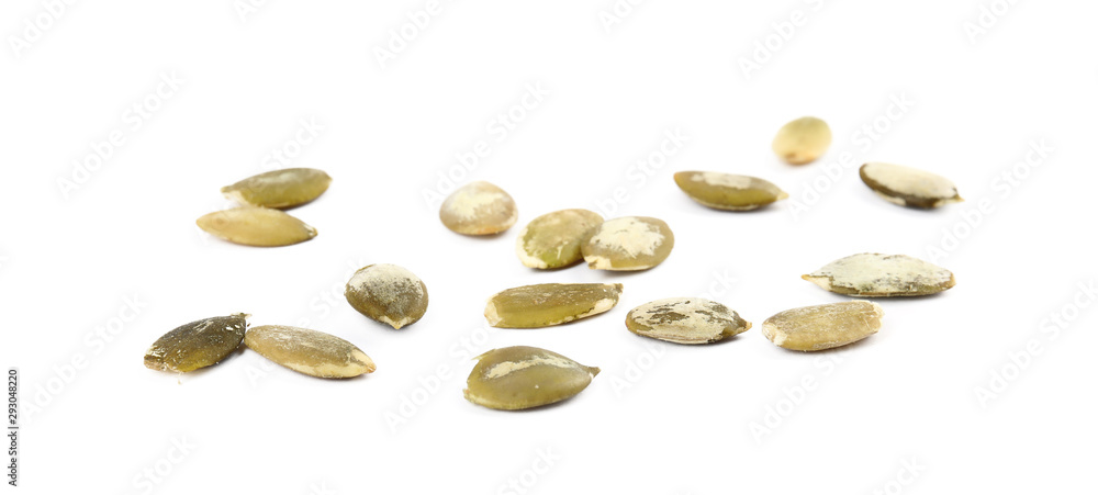 Raw peeled pumpkin seeds on white background Raw peeled pumpkin seeds on white background