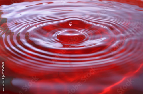 Abstract water drop splash background red