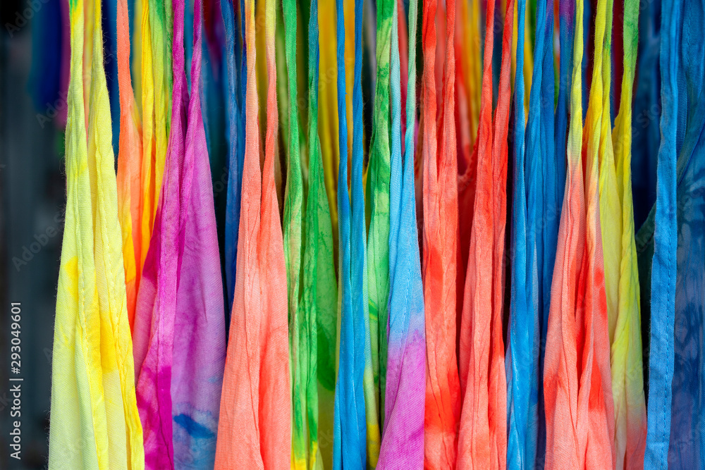 Summer clothes on hangers for sale in local street market in Thailand, close up Summer clothes on hangers for sale in local street market in Thailand, close up