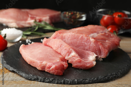 Fresh raw cut meat on slate plate