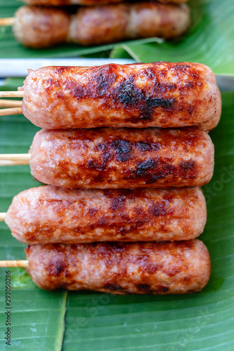 Grilled Thai sausage at street food market in Thailand. Traditional Thai sausage with pork and rice, delicious street food.