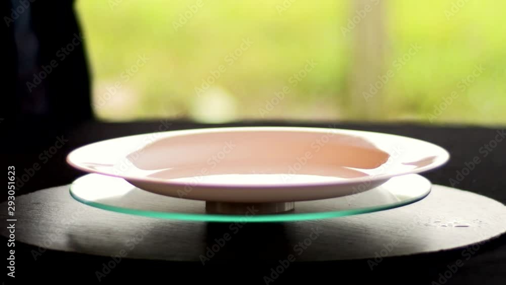 Hands cleaning luxurious dish with a napkin Hands cleaning luxurious dish with a napkin