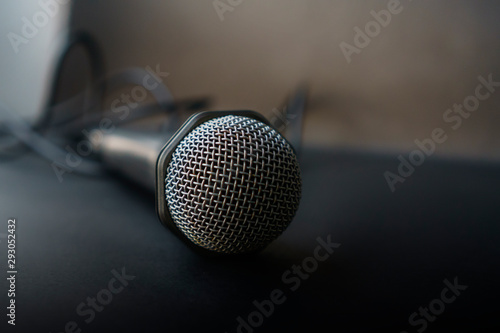 microphone on black background © chayanit