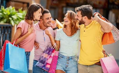 Slika na platnu Friends enjoying shopping in the city