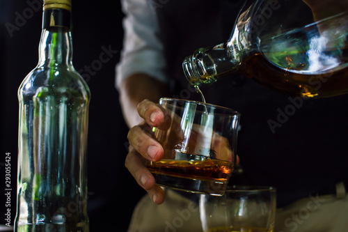 Bartender Serve Whiskey, on wood bar