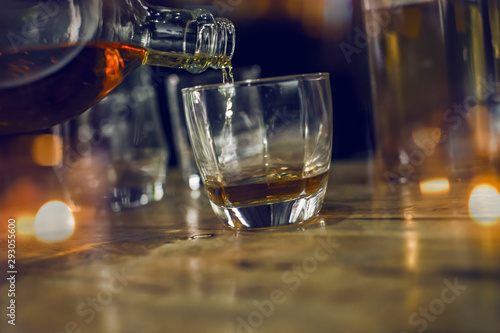 Fototapeta Naklejka Na Ścianę i Meble -  Bartender Serve Whiskey, on wood bar, 