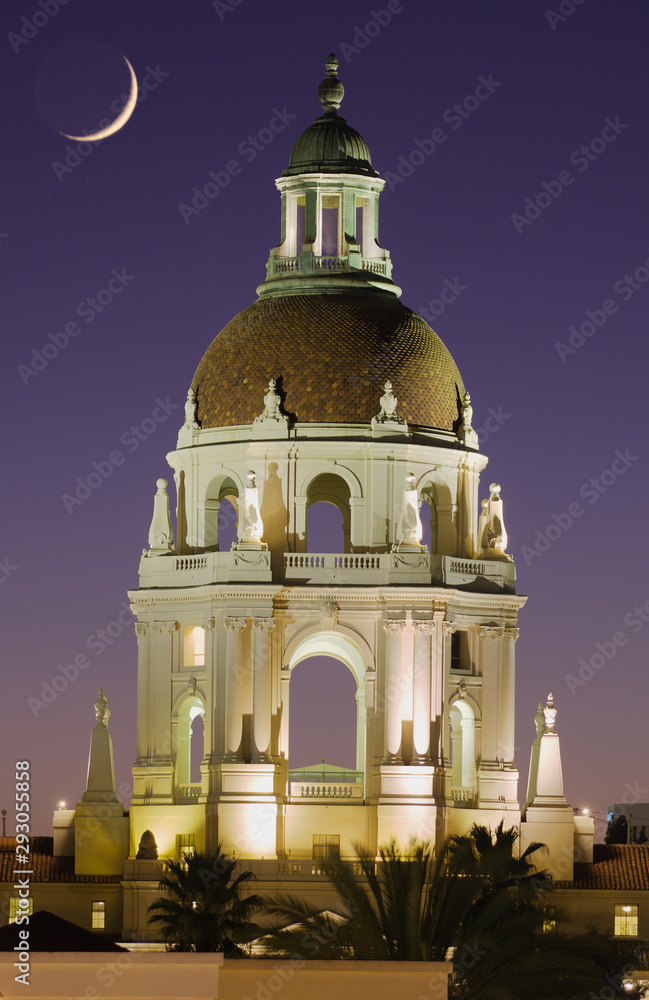 Image showing the main tower of Pasadena City Hall in Los Angeles County against a vibrant twilight sky and crescent moon.