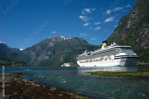 Cruise ship in Geiranger fjord in the Norwegian mountains.