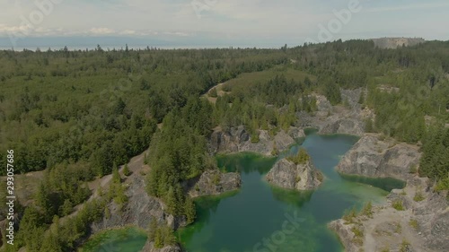 Beautiful Aerial View of the Colorful Lakes in the Canadian Nature during a sunny summer day. Taken in British Columbia, Canada. photo