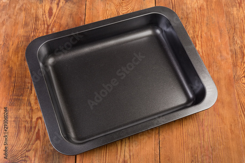 Top view of empty rectangular nonstick oven tray on table