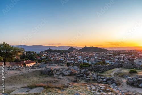 Panoramic view from Nebet tepe Hill in Plovdiv city, Bulgaria with warm autumn sunset. Ancient Plovdiv is UNESCO's World Heritage. © Petar